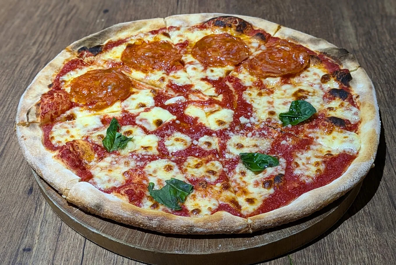 Cardi Pizzeria offers delicious half-and-half pizzas that combine fresh, high-quality toppings for a unique flavor experience